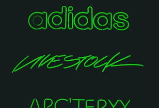 Three brand names are displayed in glowing green text against a dark background. The words are 'adidas', 'LIVESTOCK', and 'ARC'TERYX', each written in distinct styles.